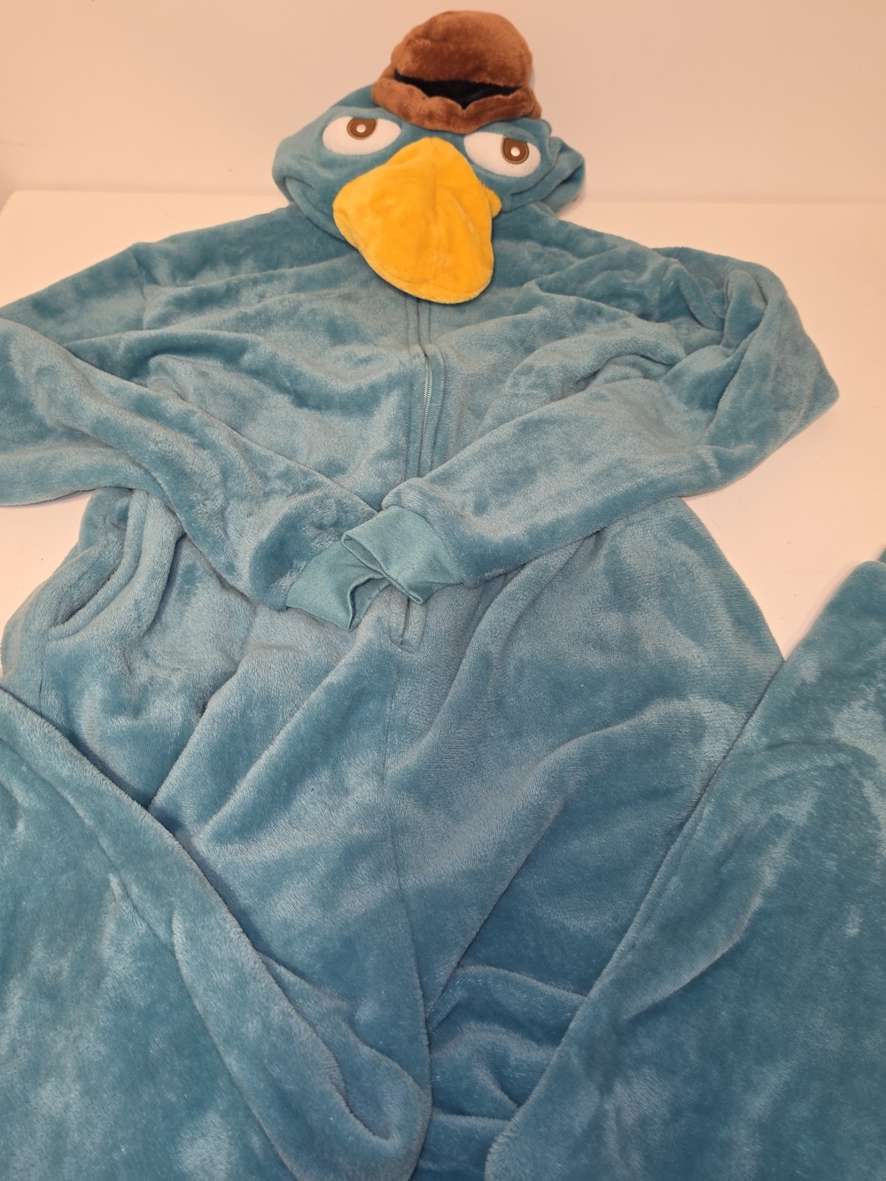 Perry the Platypus hooded onesie features a brown plush hat